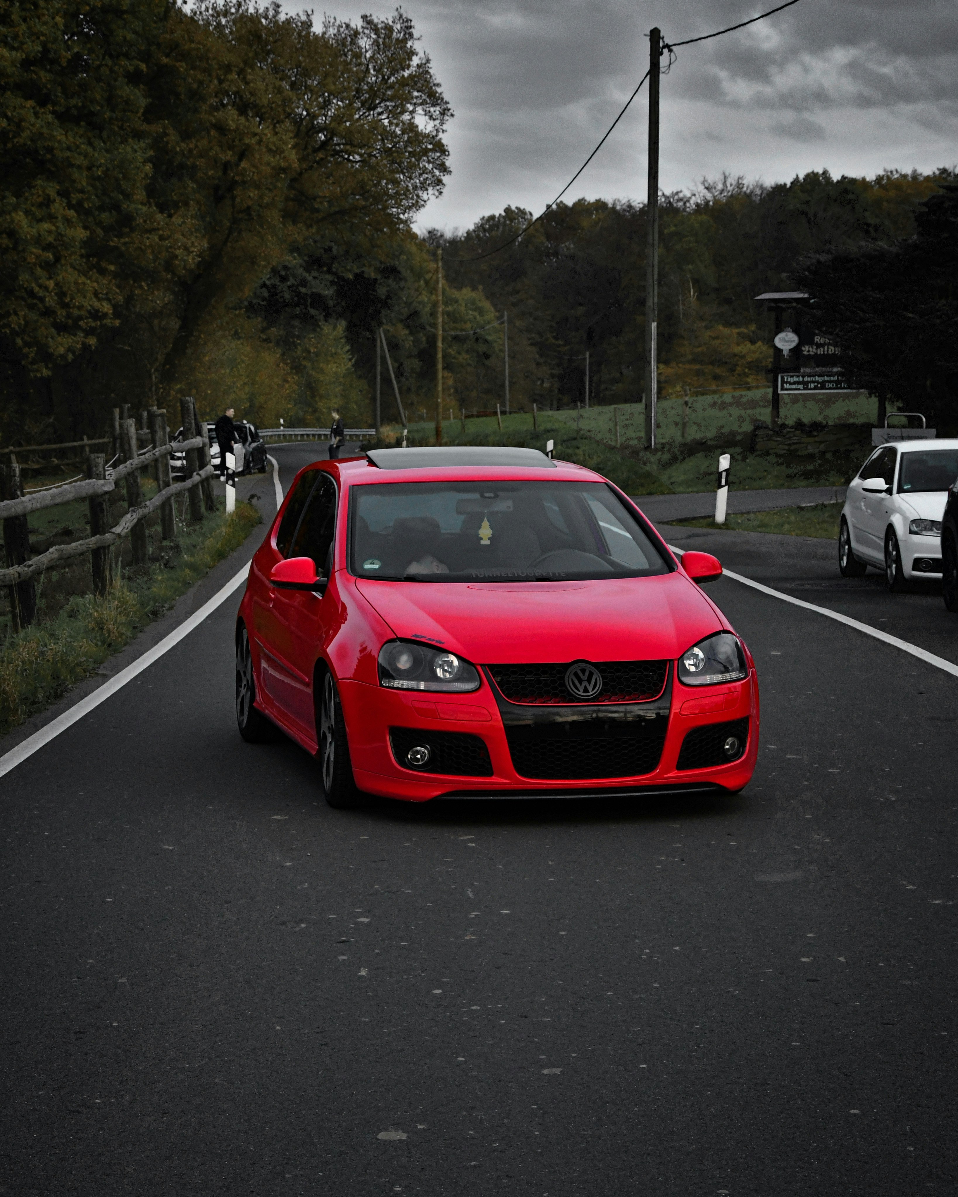 red bmw m 3 on road during daytime